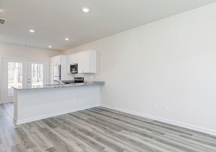 The open concept first floor allows you to move freely between the kitchen and the living room