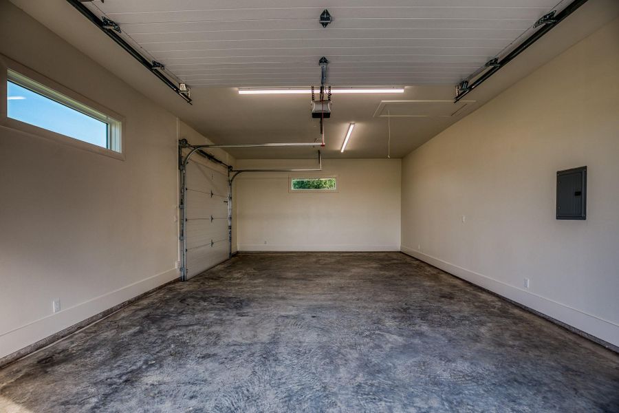 Garage with electric panel and a garage door opener Garage with electric panel and a garage door opener