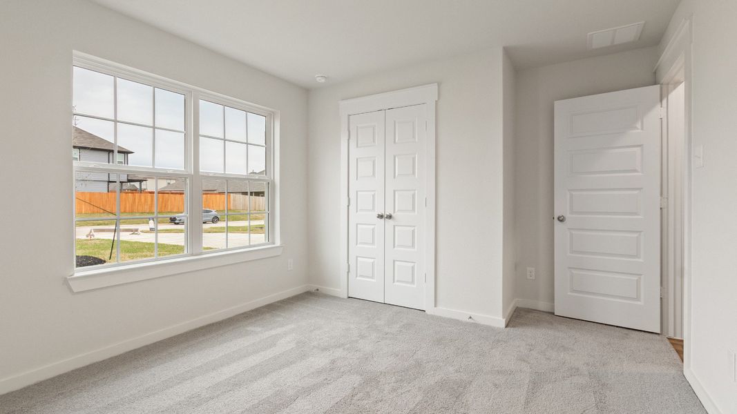 Representative furnished interior of a home built from the Driskill by Brightland Homes in Sunterra, Katy (Image 11).