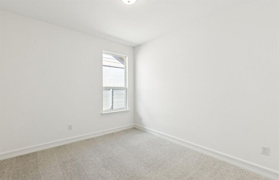 Comfortable secondary bedroom with generous closet space