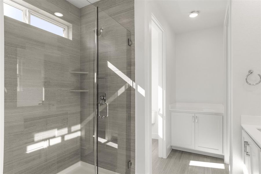 Full bathroom featuring a stall shower and vanity