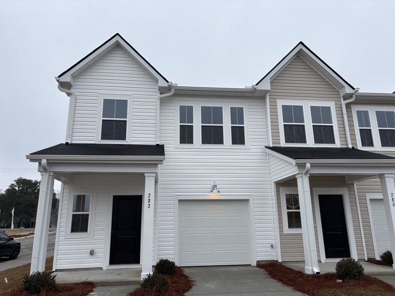 Front exterior of a new home in Limehouse Farms, Summerville, SC, highlighting curb appeal (Image 1). Front exterior of a new home in Limehouse Farms, Summerville, SC, highlighting curb appeal (Image 1).