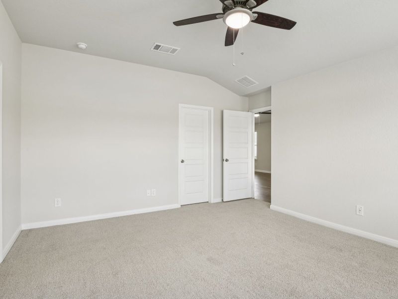 Guest bedroom in the Oleander floorplan at a Meritage Homes community.