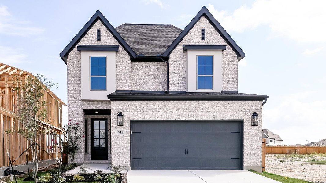 Front exterior of a new home in Legacy at Lake Dunlap, New Braunfels, TX, highlighting curb appeal (Image 20).
