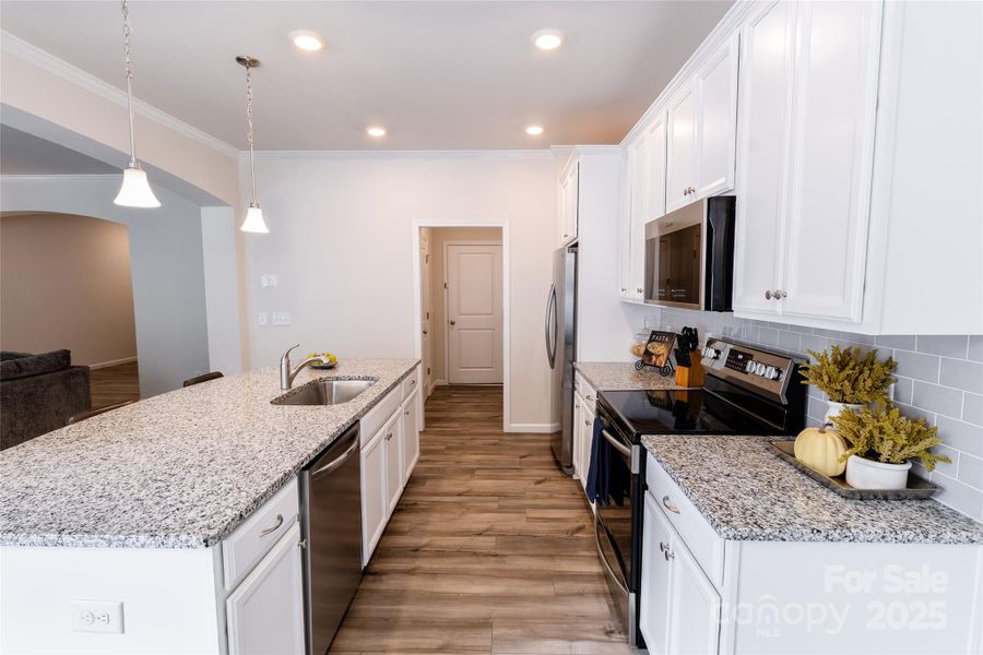 Lovely Kitchen with granite island and countertops