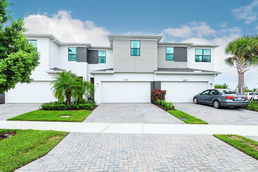 Front exterior of a new home in , Port St. Lucie, FL, highlighting curb appeal (Image 23).