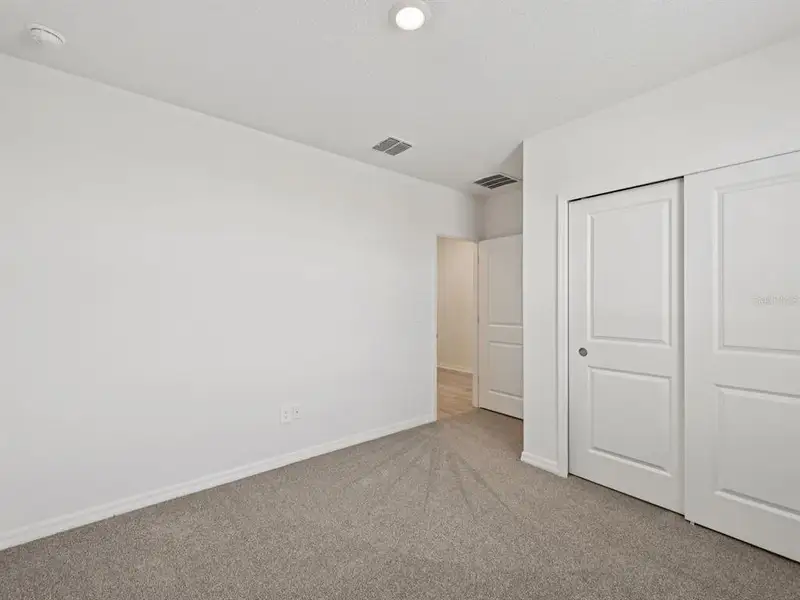Spacious, unfurnished interior of a new home in The Reserve at Van Oaks, Auburndale (Image 11).