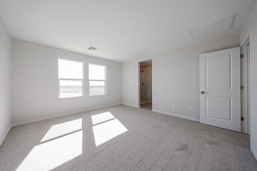A room with white walls and a door. A room with white walls and a door.