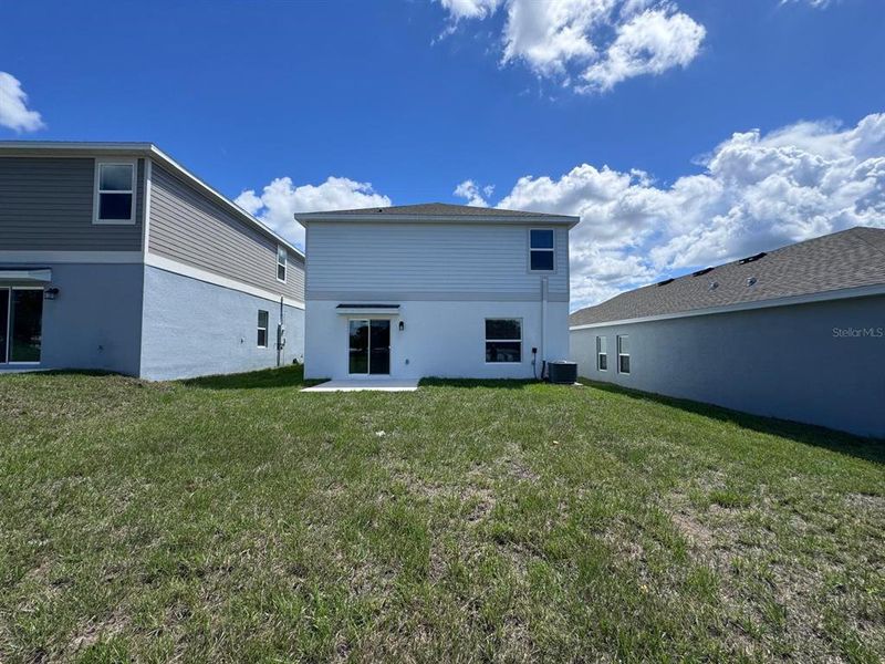 Exterior details and patio area of a home in Cascades, Davenport (Image 3).