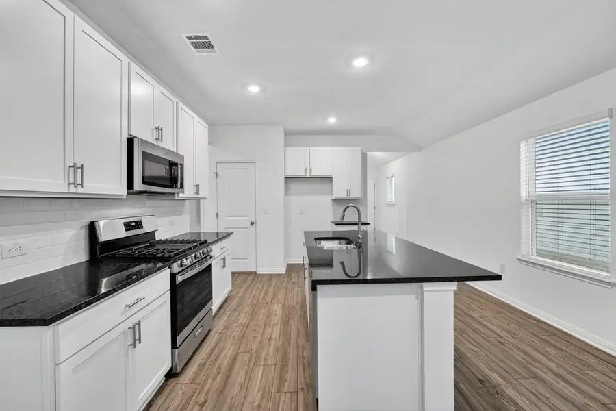 Furnished interior view inside a new home in Longview, Del Valle (Image 7).