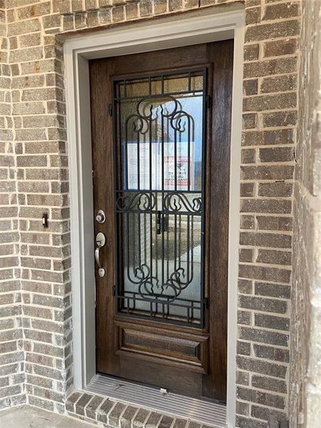 Impressive first impression with iron & glass front door