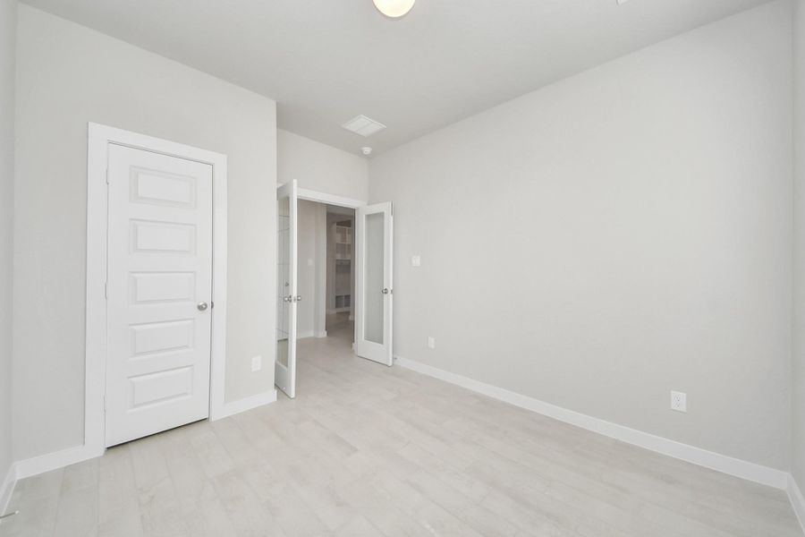 At the forefront, a refined home office beckons productivity and focus. Luxurious details like elegant tile flooring, custom paint, expansive windows with privacy blinds, and French doors create an inspiring workspace. Sample photo of completed home with similar floor plan. Actual colors and selections may vary. At the forefront, a refined home office beckons productivity and focus. Luxurious details like elegant tile flooring, custom paint, expansive windows with privacy blinds, and French doors create an inspiring workspace. Sample photo of completed home with similar floor plan. Actual colors and selections may vary.