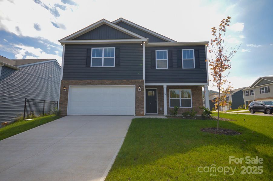 Front exterior of a new home in Patton Cove, Clyde, NC, highlighting curb appeal (Image 1).