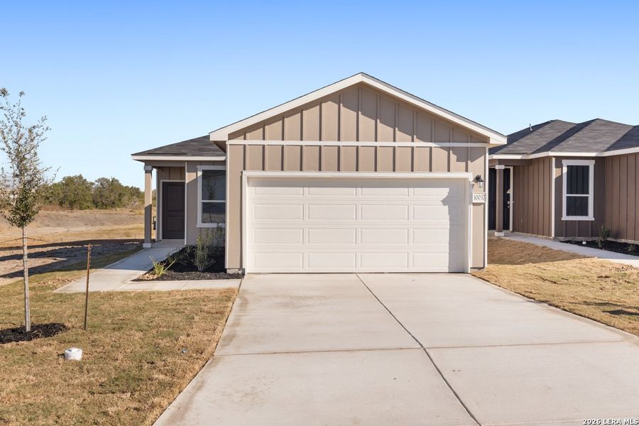 Front exterior of a new home in Punta Verde, Converse, TX, highlighting curb appeal (Image 2). Front exterior of a new home in Punta Verde, Converse, TX, highlighting curb appeal (Image 2).