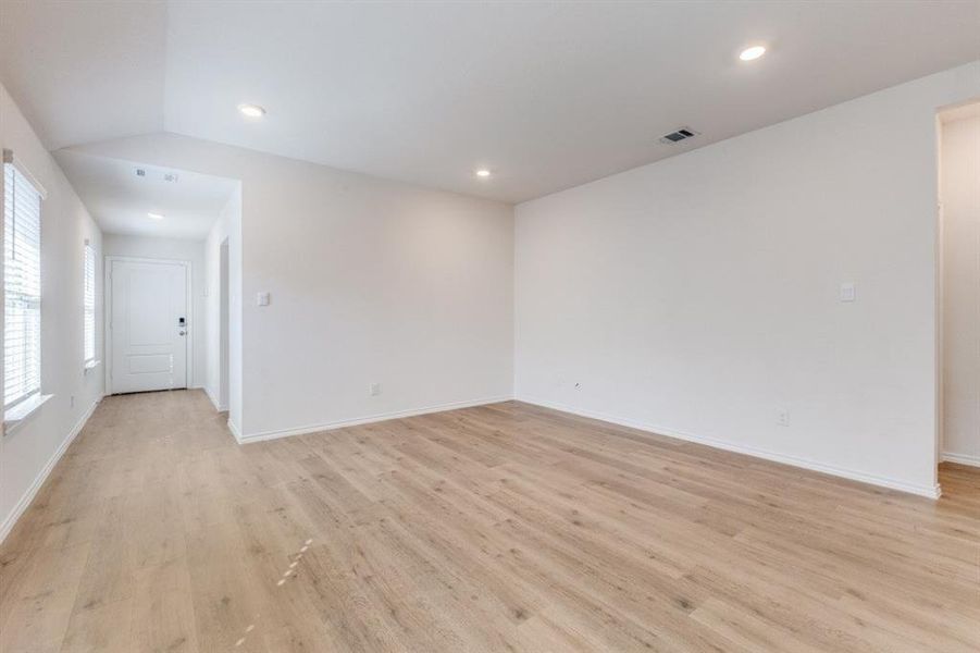 Spare room featuring light wood finished floors and recessed lighting Spare room featuring light wood finished floors and recessed lighting