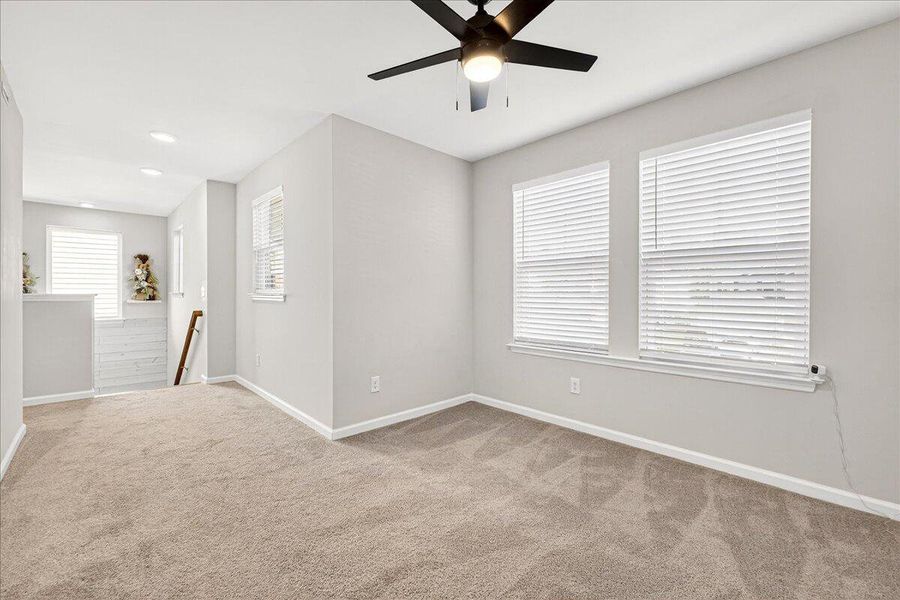Spacious, unfurnished interior of a new home in Jasmine Point at Lakes of Cane Bay, Summerville (Image 17).