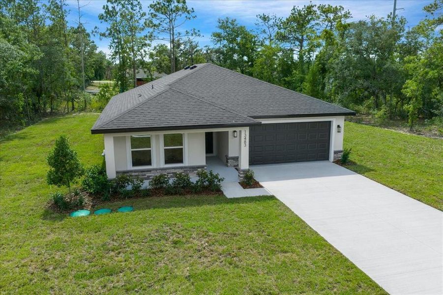 Front exterior of a new home in , Brooksville, FL, highlighting curb appeal (Image 24). Front exterior of a new home in , Brooksville, FL, highlighting curb appeal (Image 24).