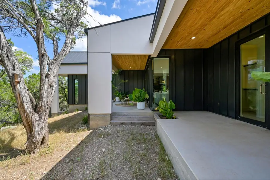 Front exterior of a new home in , Jonestown, TX, highlighting curb appeal (Image 2). Front exterior of a new home in , Jonestown, TX, highlighting curb appeal (Image 2).