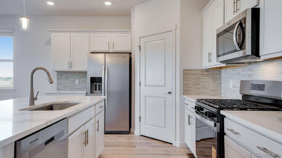 Furnished interior view inside a new home in Trails at Crowfoot, Parker (Image 7).