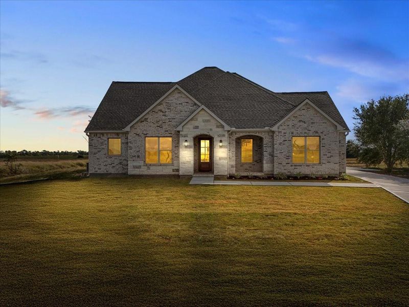 Front exterior of a new home in , Angleton, TX, highlighting curb appeal (Image 2).