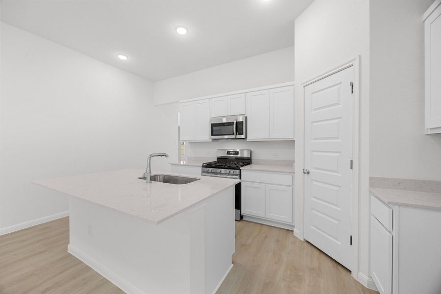 Kitchen in the Cypress home plan by Trophy Signature Homes - REPRESENTATIVE PHOTO Kitchen in the Cypress home plan by Trophy Signature Homes - REPRESENTATIVE PHOTO