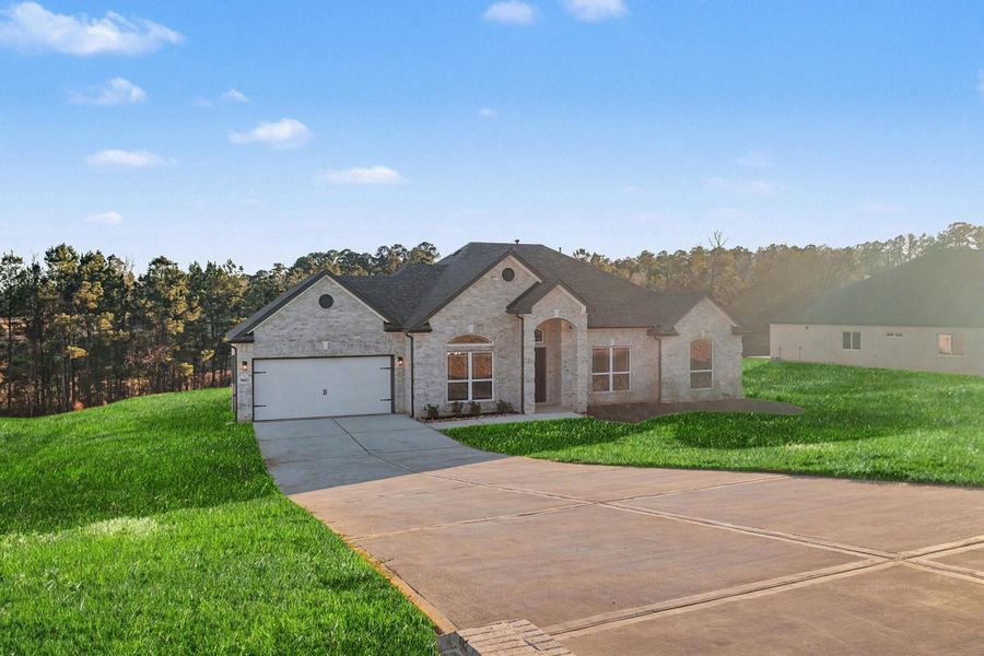 Front exterior of a new home in Rose Hill Estates, Willis, TX, highlighting curb appeal (Image 20).
