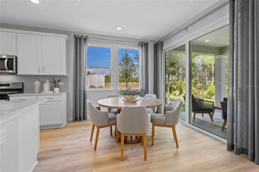 Furnished interior view inside a new home in The Magnolia Series at Reserve East, Flagler Beach (Image 16).