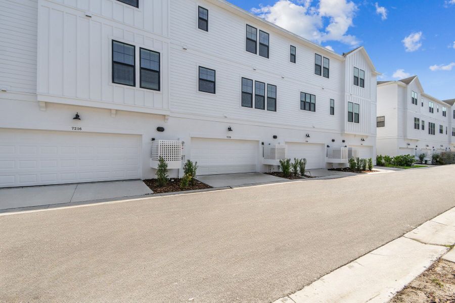 Exterior details and patio area of a home in Emerald Landing at Waterside at Lakewood Ranch – City Homes, Sarasota (Image 3).