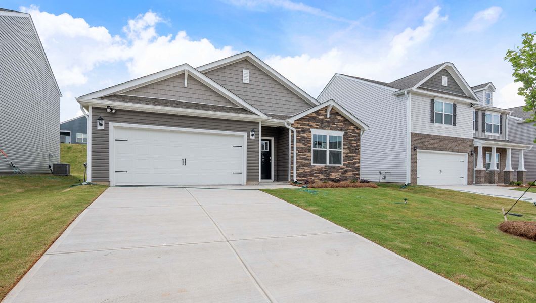 Front exterior of a new home in Woodhaven, Spartanburg, SC, highlighting curb appeal (Image 1). Front exterior of a new home in Woodhaven, Spartanburg, SC, highlighting curb appeal (Image 1).