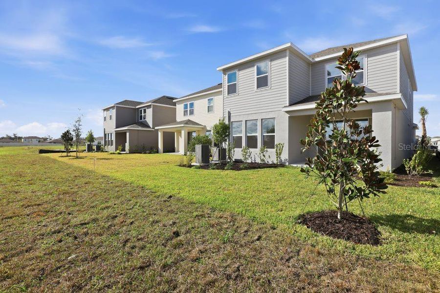 Exterior details and patio area of a home in Indigo Creek, Apollo Beach (Image 26).