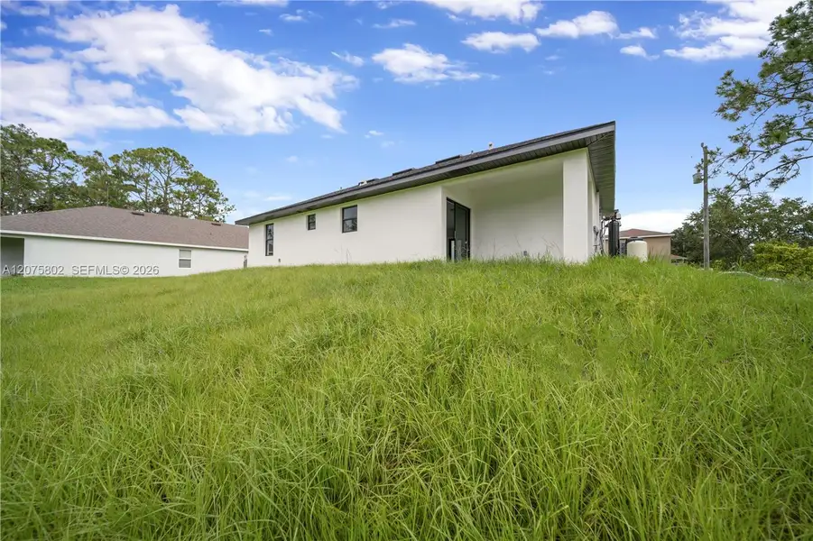 Exterior details and patio area of a home in , Lehigh Acres (Image 3).