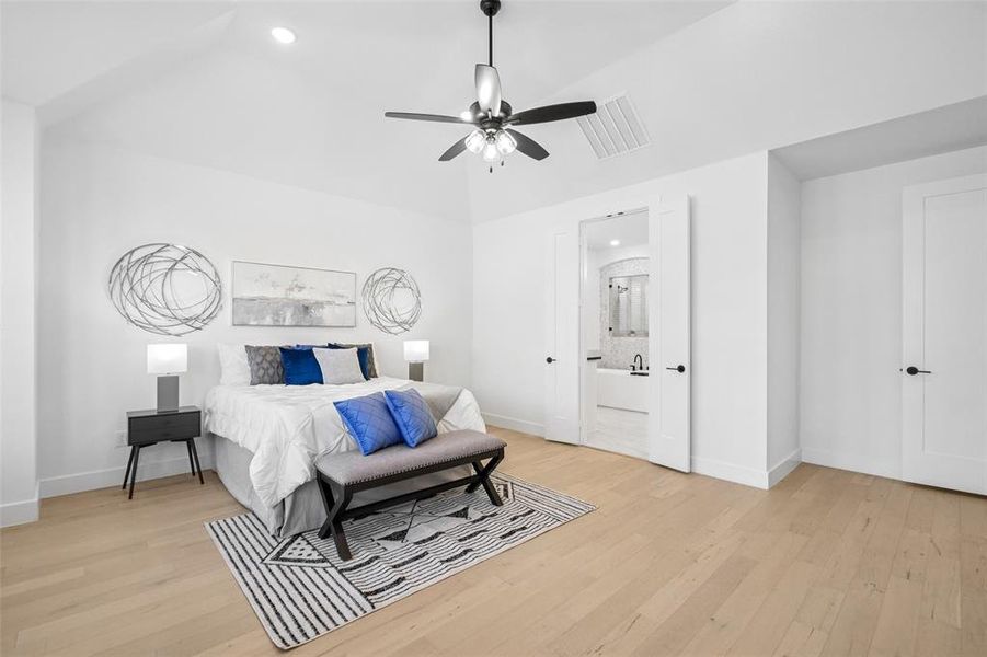 Bedroom featuring recessed lighting, light wood-style floors, and ceiling fan Bedroom featuring recessed lighting, light wood-style floors, and ceiling fan