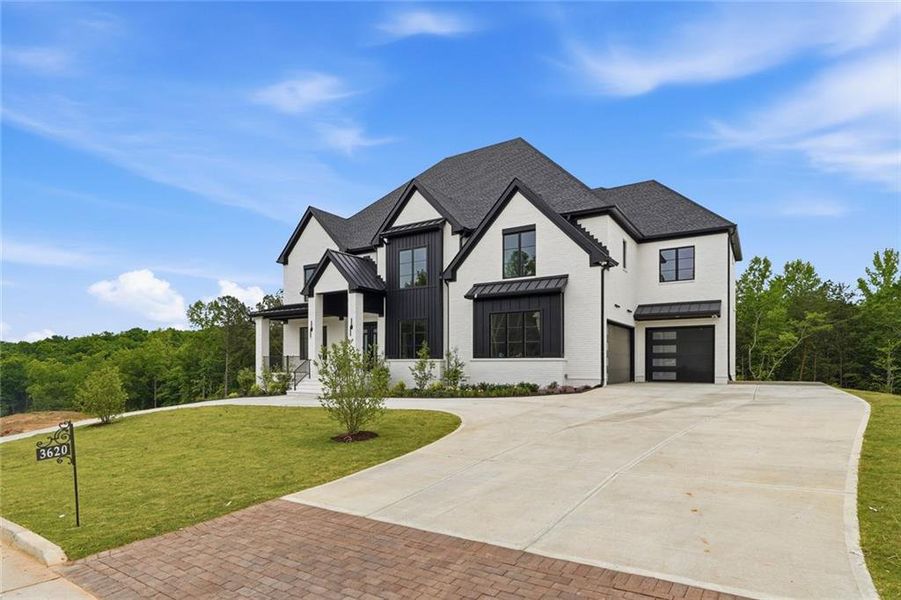 Front exterior of a new home in , Cumming, GA, highlighting curb appeal (Image 1). Front exterior of a new home in , Cumming, GA, highlighting curb appeal (Image 1).