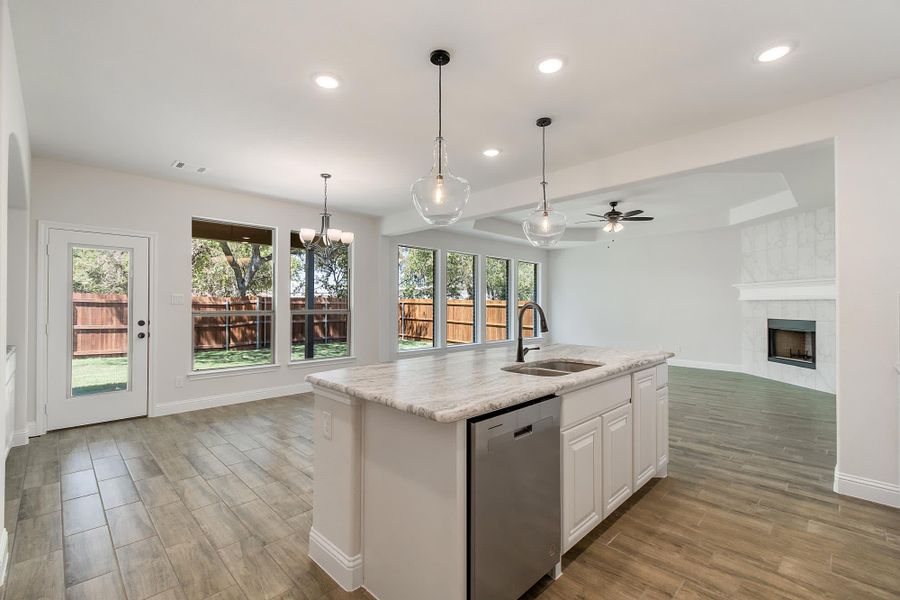 Kitchen to Family Room | Concept 2972 at Villages of Walnut Grove in Midlothian, TX by Landsea Homes