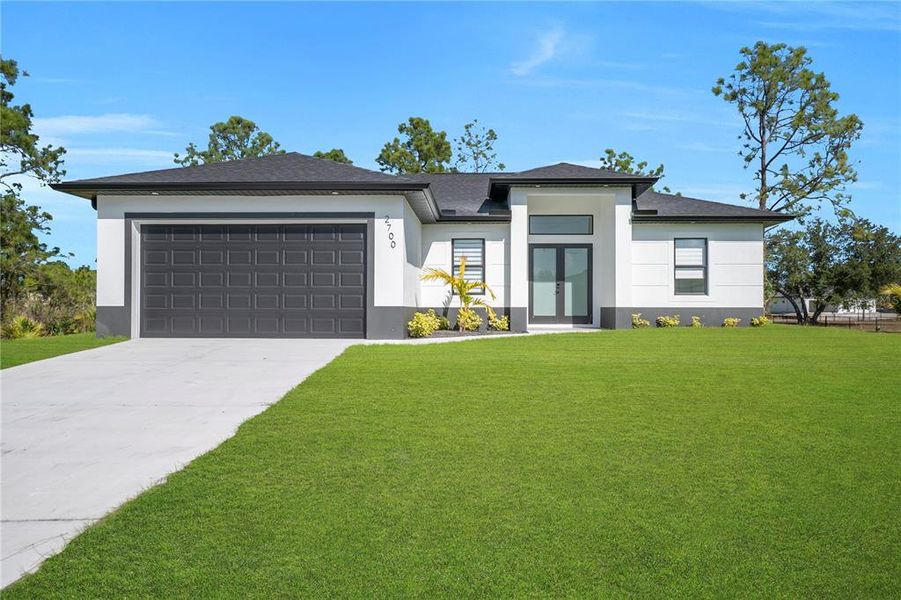 Front exterior of a new home in , Lehigh Acres, FL, highlighting curb appeal (Image 2). Front exterior of a new home in , Lehigh Acres, FL, highlighting curb appeal (Image 2).
