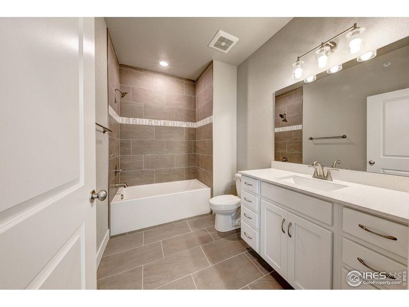 Furnished interior view inside a new home in Highlands at Fox Hill - The Flats, Longmont (Image 6).