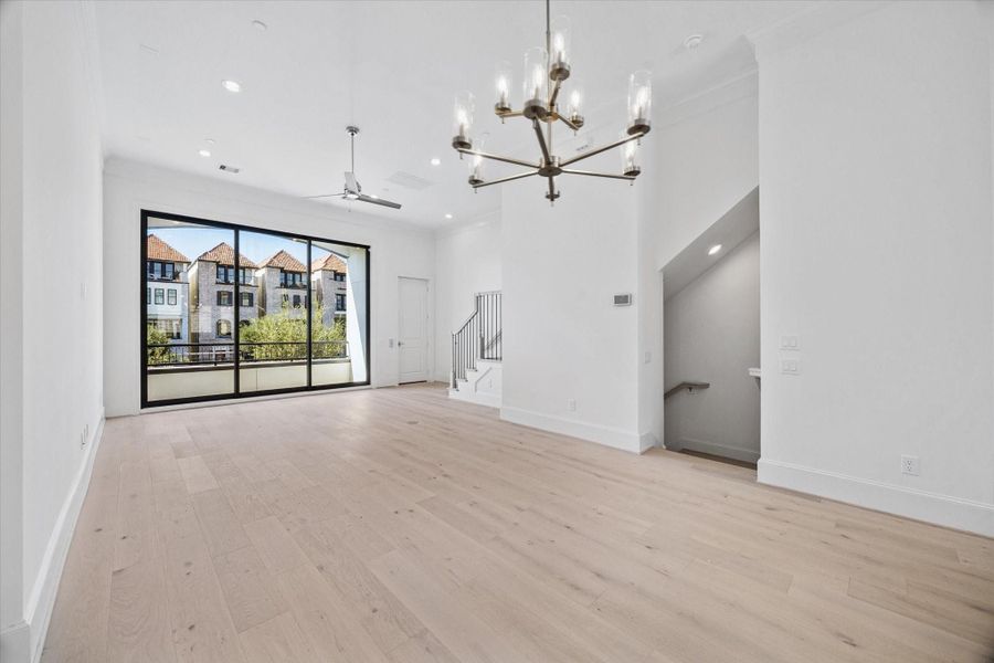 10' sliding stacking doors to the balcony. Photos are of a similar home with the same finishes.