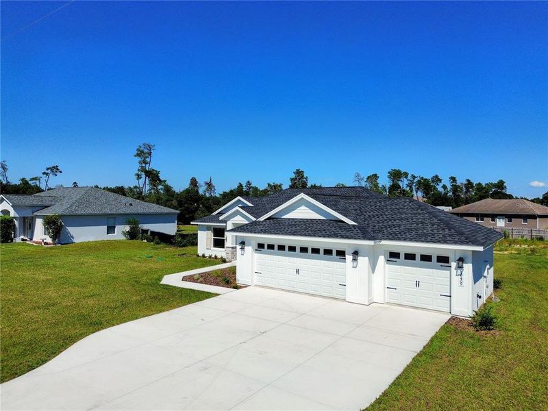 Front exterior of a new home in , Ocala, FL, highlighting curb appeal (Image 26).