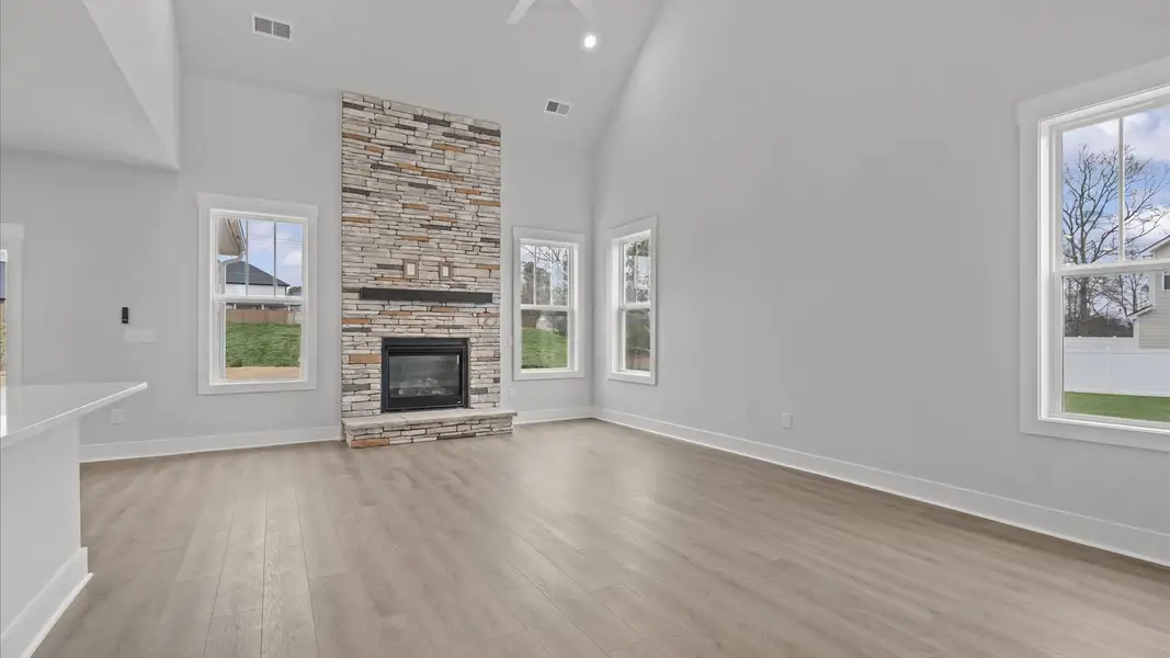First-class living space featuring expansive ceilings, elegant design, and open sightlines to the kitchen