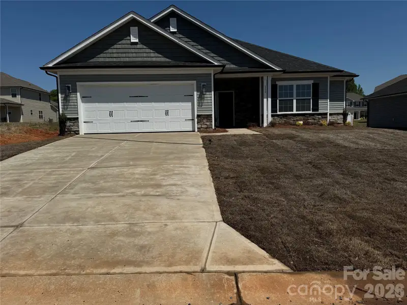 Front exterior of a new home in Kerns Ridge, Salisbury, NC, highlighting curb appeal (Image 1). Front exterior of a new home in Kerns Ridge, Salisbury, NC, highlighting curb appeal (Image 1).