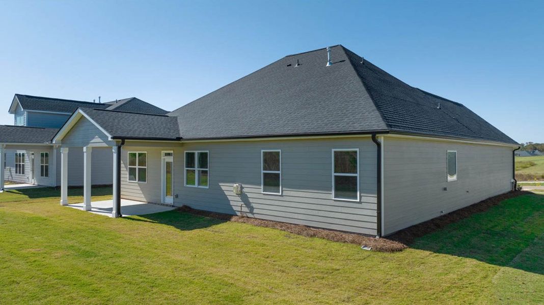 Front exterior of a new home in The Gates at Pates Creek, Hampton, GA, highlighting curb appeal (Image 16).