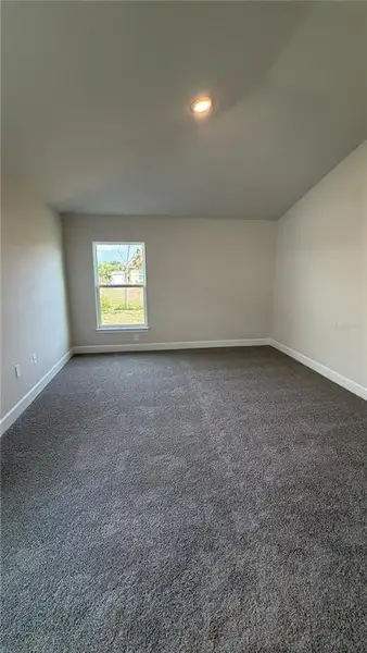 Spacious, unfurnished interior of a new home in Watercress Cove, North Port (Image 5).