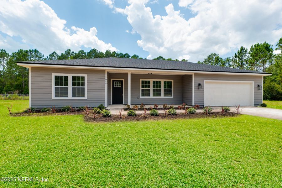Front exterior of a new home in , Middleburg, FL, highlighting curb appeal (Image 18).