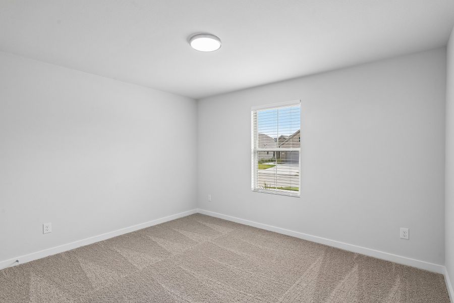 Bedroom in the Hayden home plan by Trophy Signature Homes