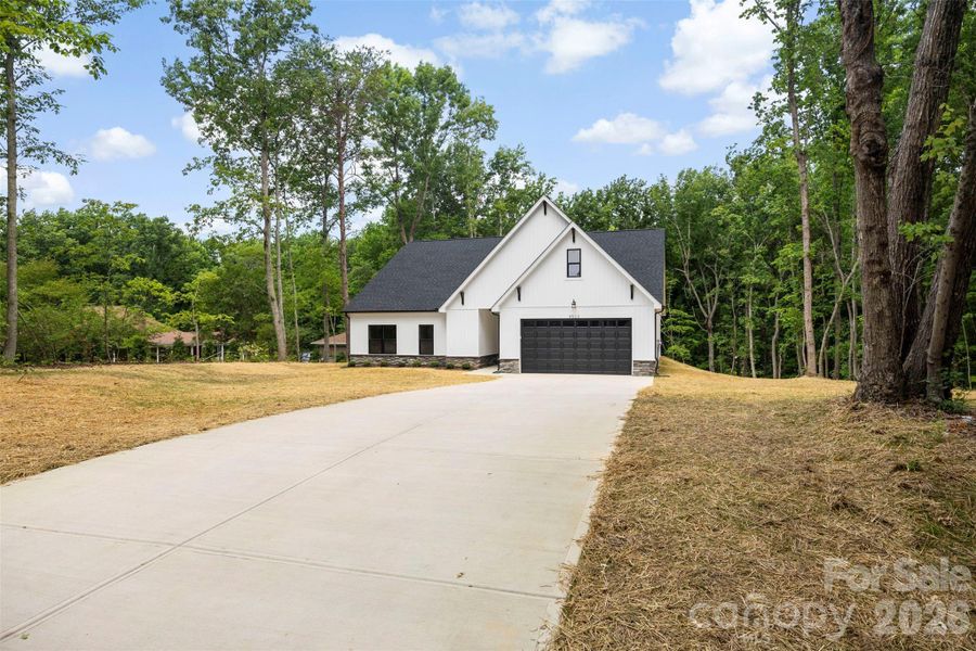 Front exterior of a new home in , Gastonia, NC, highlighting curb appeal (Image 24).