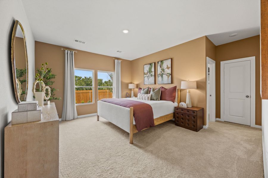 A bedroom with a large bed. A bedroom with a large bed.