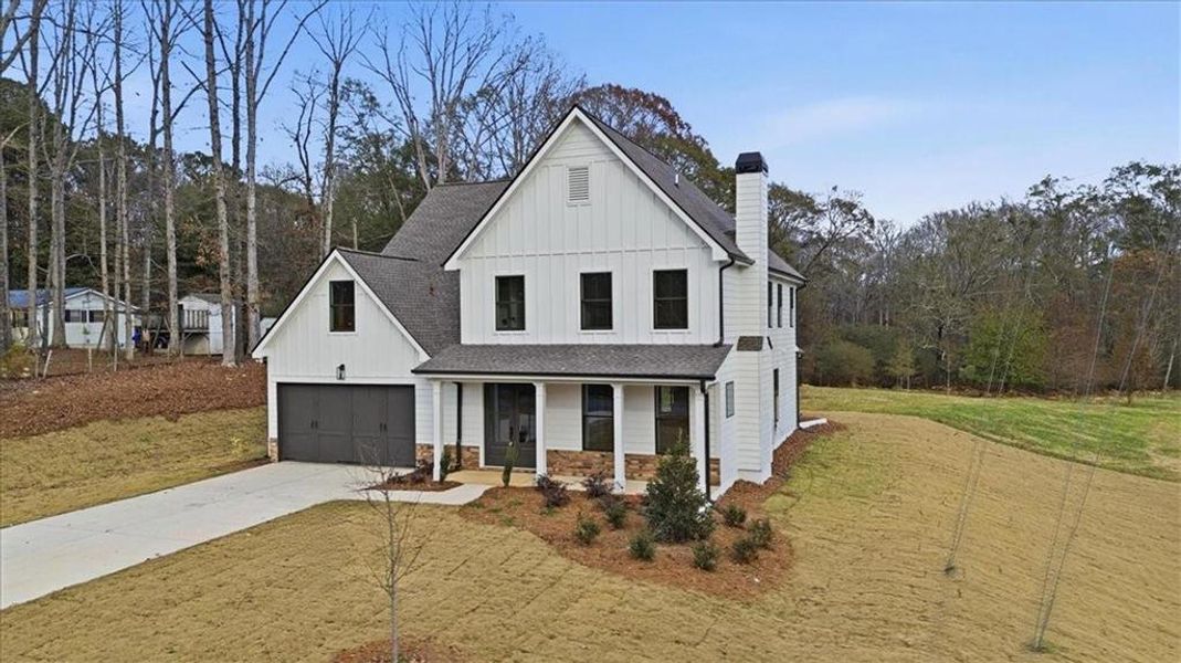 Front exterior of a new home in , Statham, GA, highlighting curb appeal (Image 33).