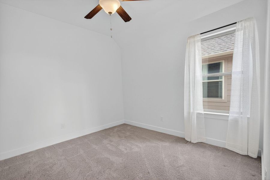 This secondary bedroom is located on the 2nd floor. Lots of natural light, high ceilings and a ceiling fan! 31418 Golden Cliffs Ln., Fulshear, TX 77441 This secondary bedroom is located on the 2nd floor. Lots of natural light, high ceilings and a ceiling fan! 31418 Golden Cliffs Ln., Fulshear, TX 77441