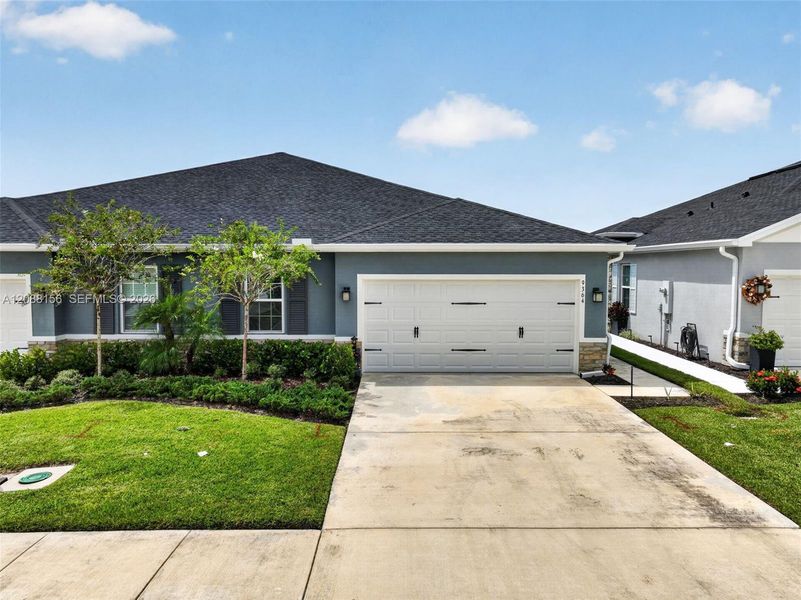 Front exterior of a new home in , Port St. Lucie, FL, highlighting curb appeal (Image 24). Front exterior of a new home in , Port St. Lucie, FL, highlighting curb appeal (Image 24).