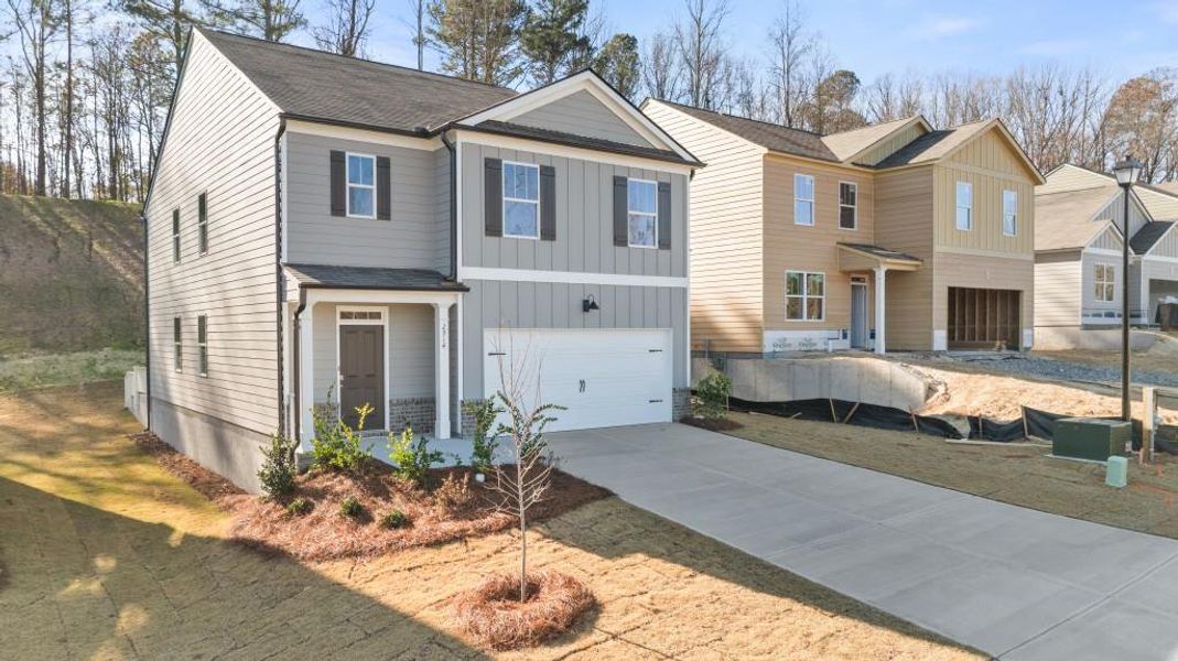 Front exterior of a new home in Oconee Overlook, Gainesville, GA, highlighting curb appeal (Image 1). Front exterior of a new home in Oconee Overlook, Gainesville, GA, highlighting curb appeal (Image 1).